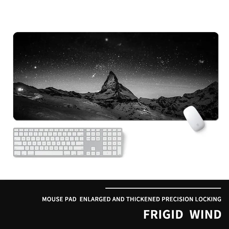 Oversized rubber mouse pad with gaming graphic design and wrist strap on desk