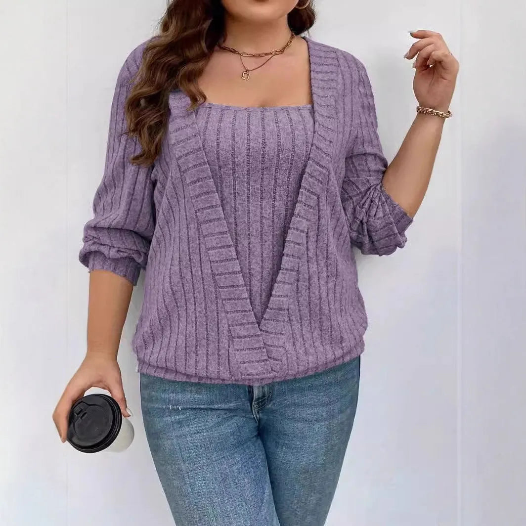 Women's solid colour false two-piece suit with V-neck and long sleeves in polyester rib fabric.