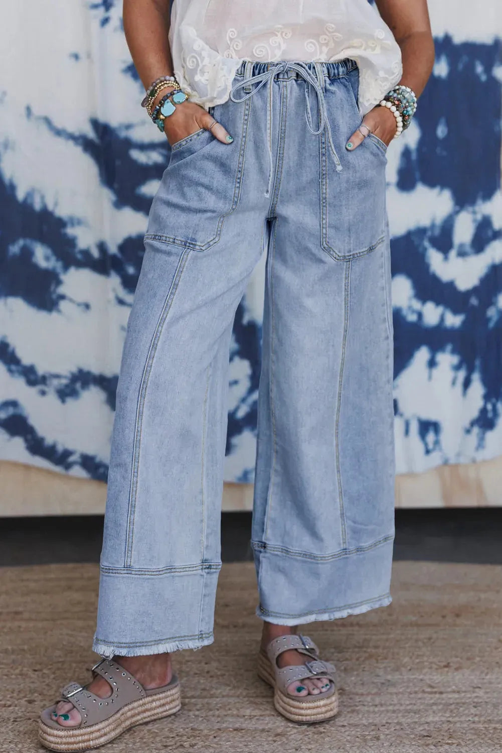 Beau blue wide leg denim pants with drawstring waist and raw hem seam detail