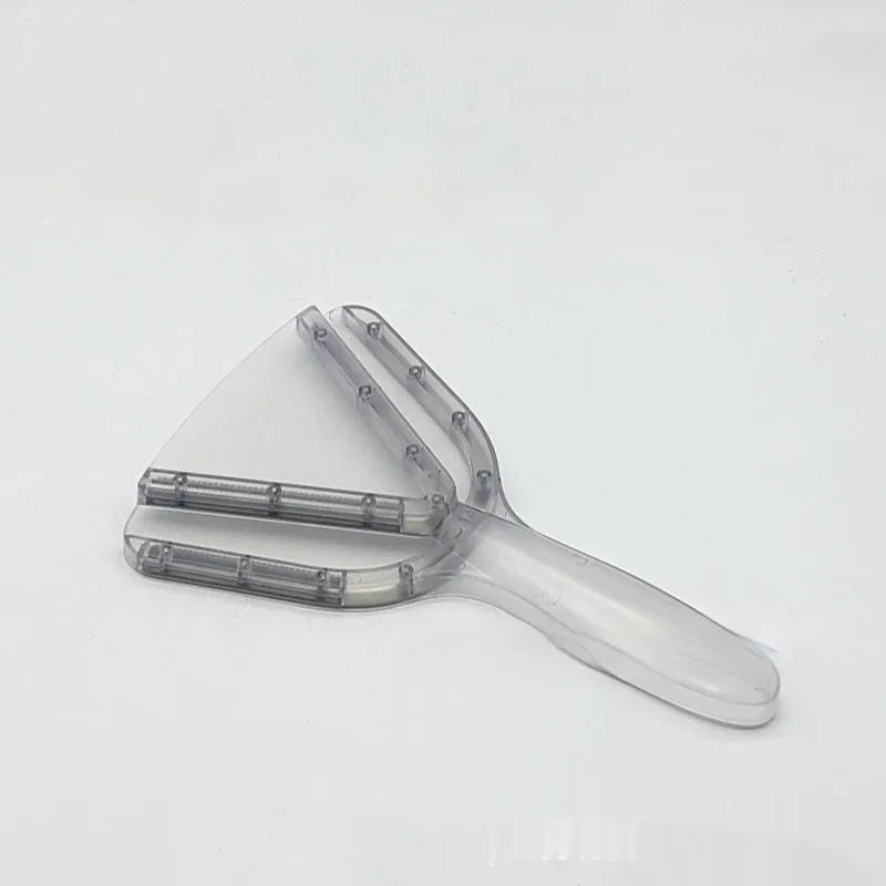 Red telescopic bottle opener with non-slip jaws, shown extended on a kitchen counter.