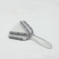 Red telescopic bottle opener with non-slip jaws, shown extended on a kitchen counter.