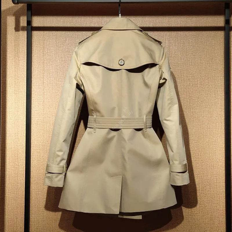 Khaki women's trench coat with double-breasted button front and structured flight sleeves