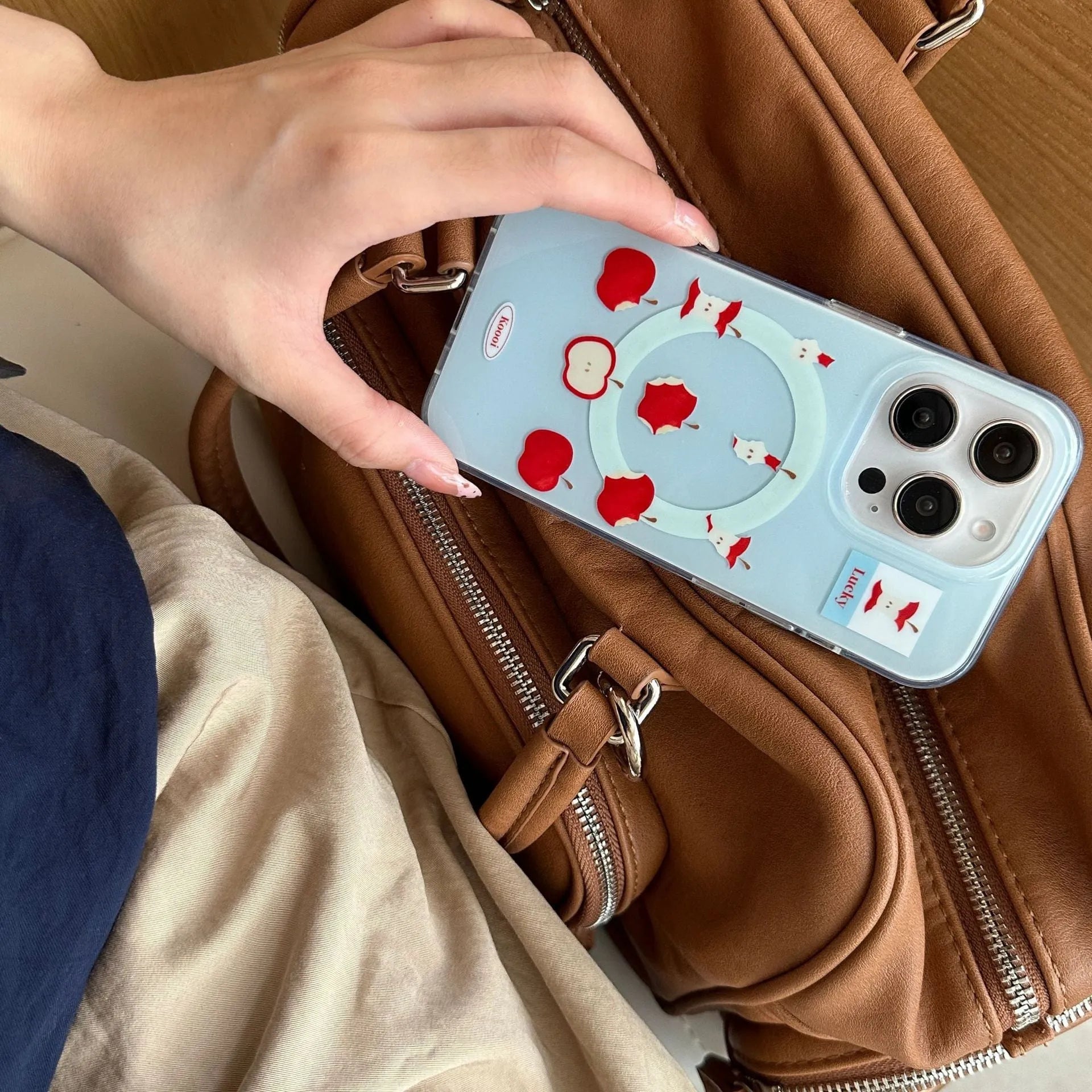 Blue magnetic TPU phone case for iPhone with embossed texture and bracket variant