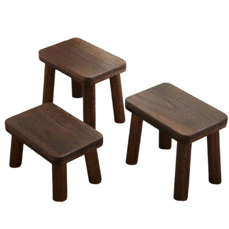 Solid wood household changing stool with a distressed finish and bracket structure.