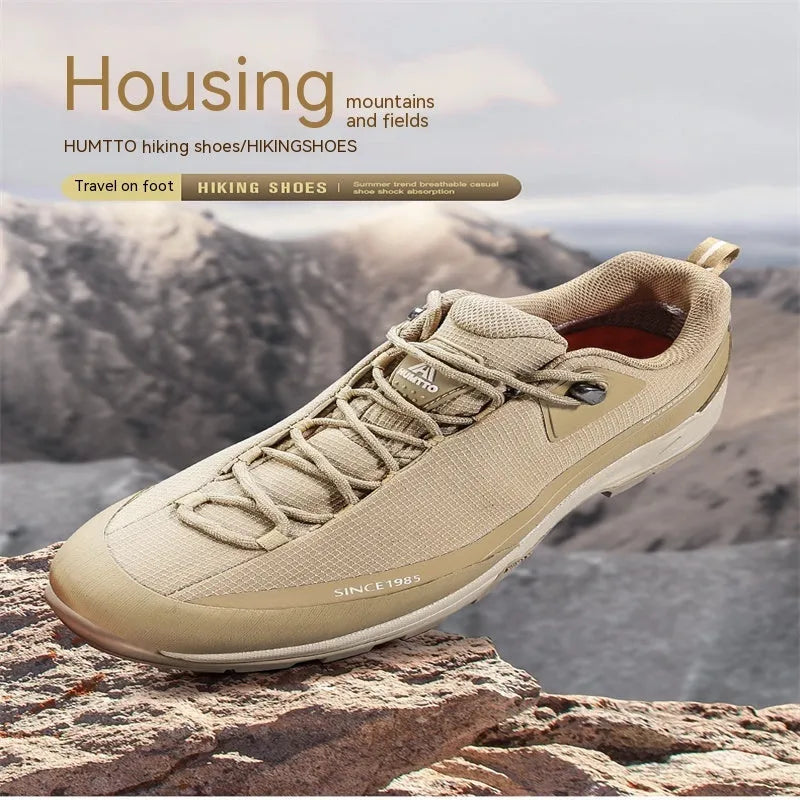 Men's low-top leather mesh hiking boots with front laces and a non-slip rubber outsole