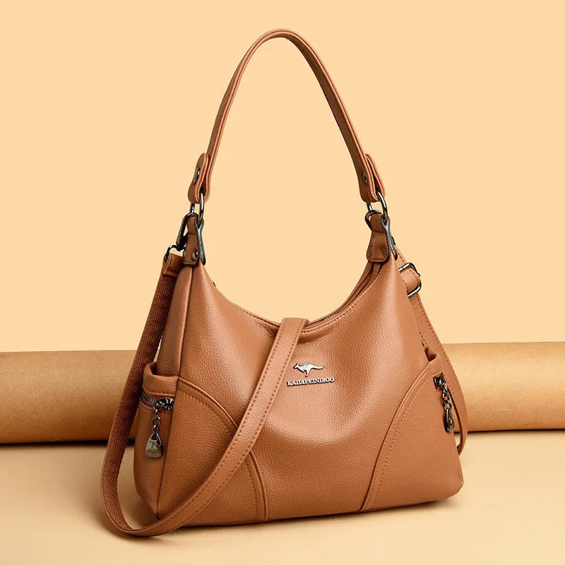 Women's soft PU leather messenger bag in beige with horizontal square shape and lined interior