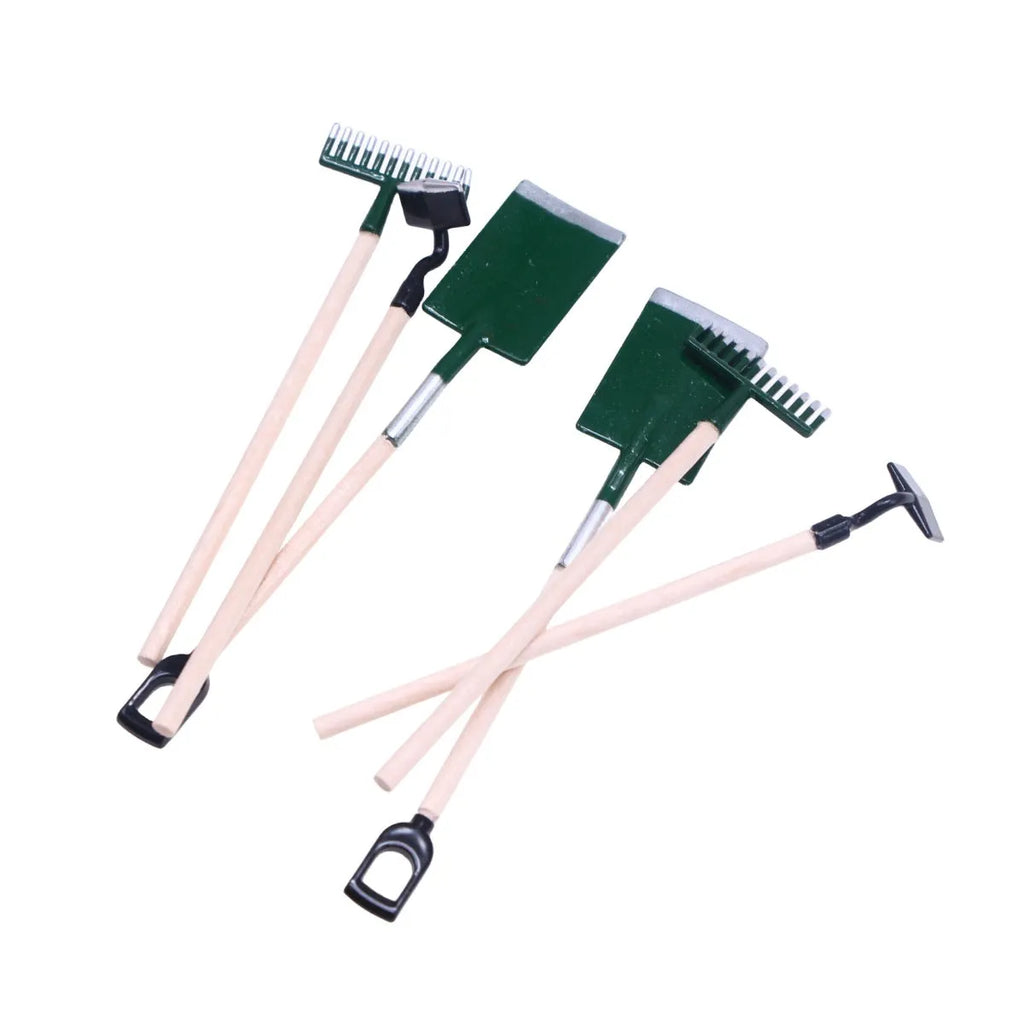 Three miniature alloy gardening tools set for dollhouse or elf garden scenes on white background