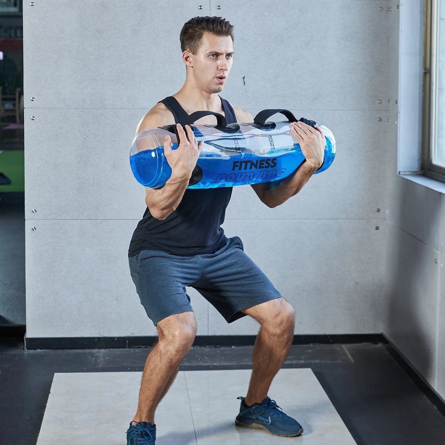 Transparent PVC water injection weight training bag showing adjustable fill levels from 5kg to 50kg capacity
