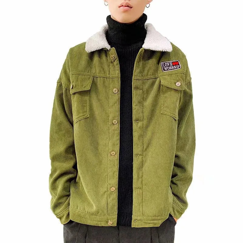 Man wearing a loose-fit khaki corduroy work jacket with side pockets.