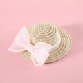 Woven Lafite leaf cat hat with pearl butterfly bow on a pink background, showing S and M size options.