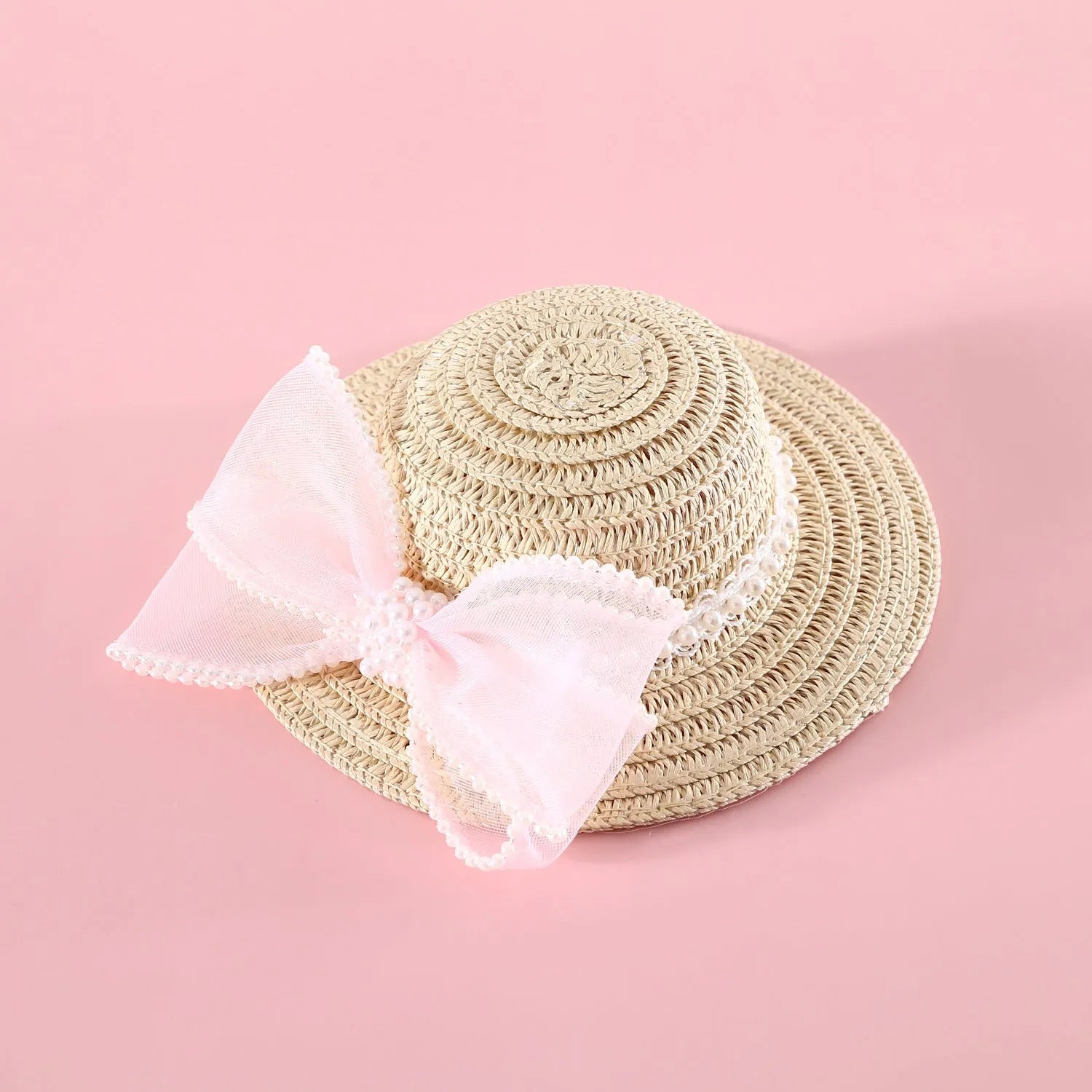 Woven Lafite leaf cat hat with pearl butterfly bow on a pink background, showing S and M size options.