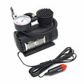 Black 12V portable mini air compressor with 300 psi gauge, 9-foot cord, and two adapter nozzles on a neutral background