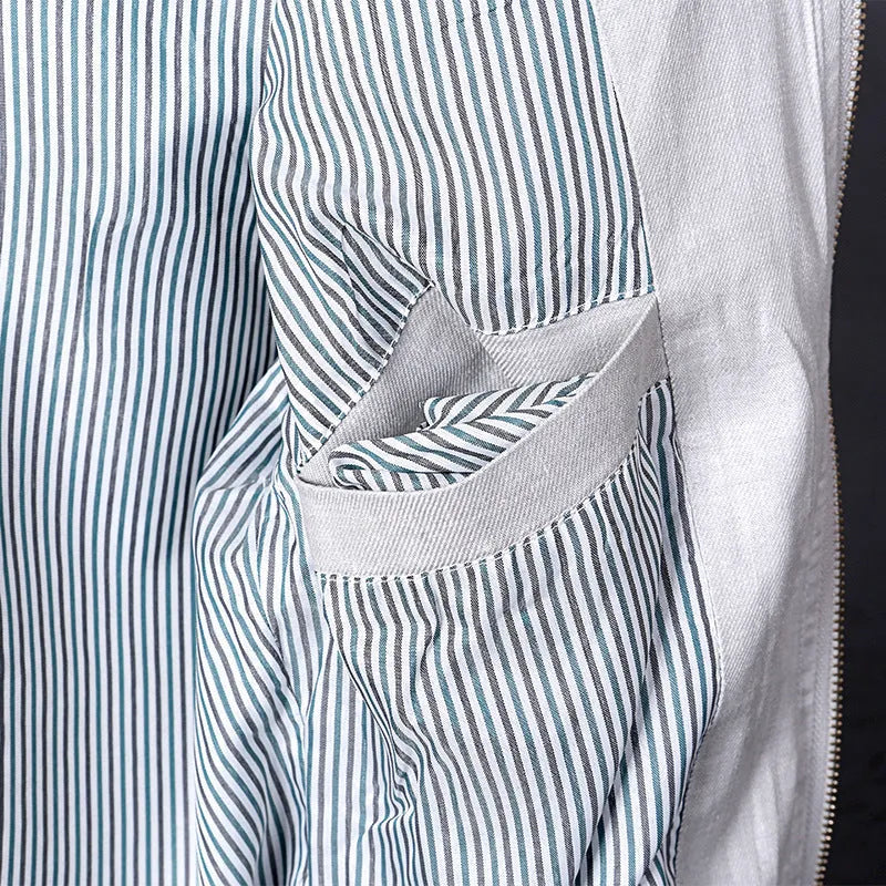 Men's thin blue cotton linen jacket on a hanger, showing regular cut and front button design.