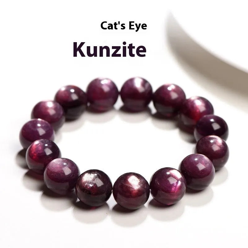 Close-up of a handcrafted purple lepidolite crystal bracelet with polished round beads on a wrist.