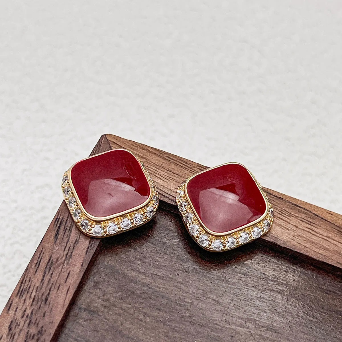 Red square plate earrings with geometric alloy construction and retro styling