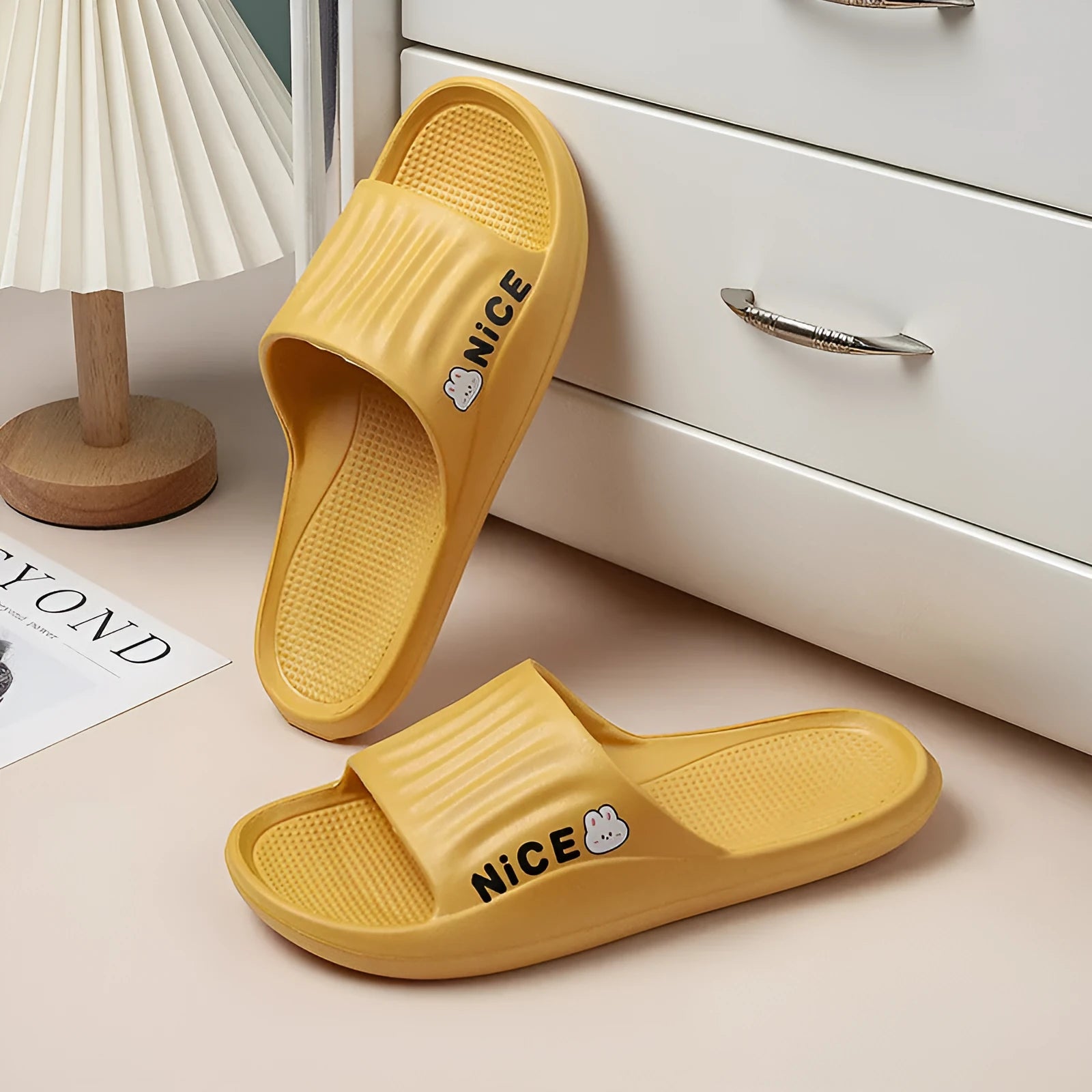 Adult cartoon pattern EVA slippers in multiple colours on a non-slip sole.