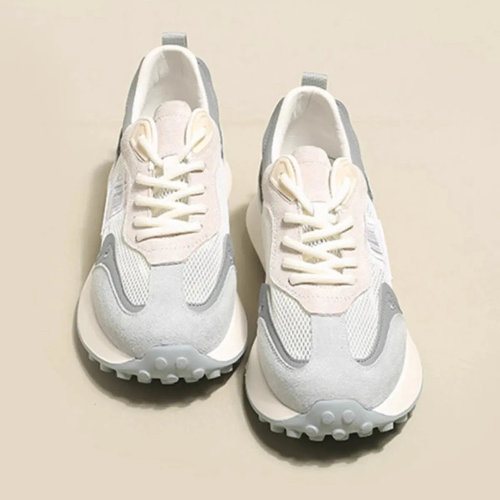 Women's grey and pink retro sneaker with low-top design and rubber sole