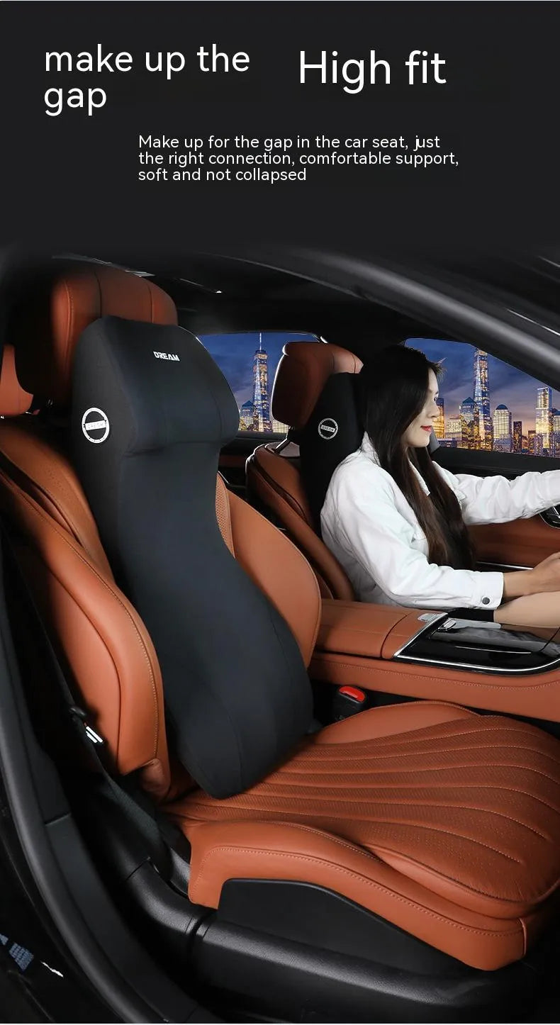 Black integrated memory foam car cushion and lumbar support pillow on a car seat.