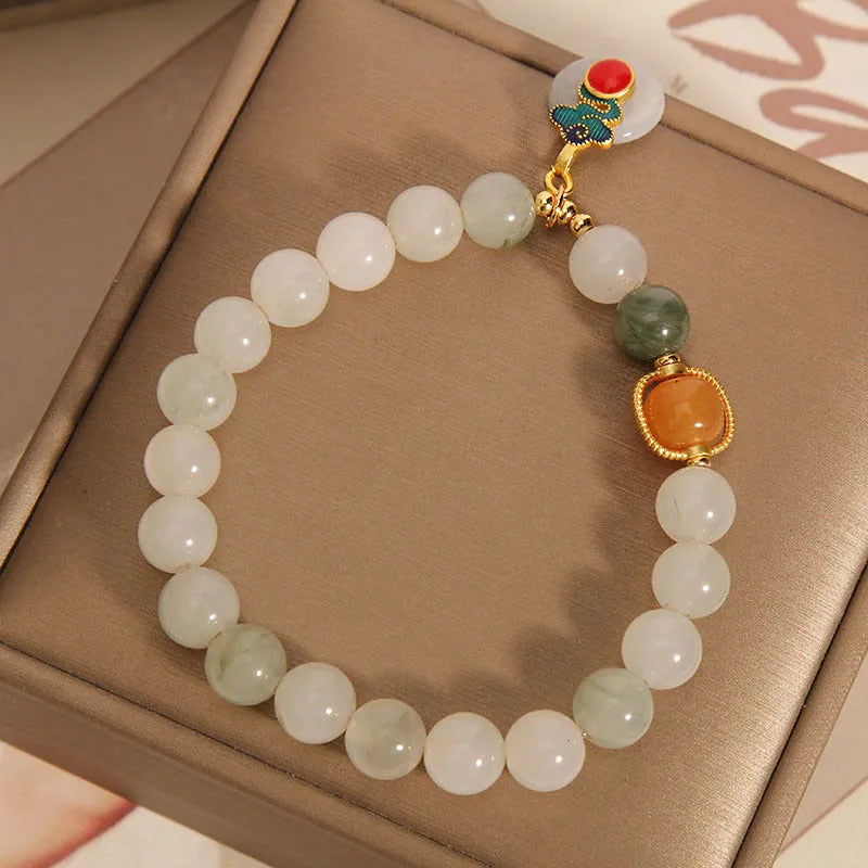 Women's ice jade crystal bracelet with pearl accents and a jade buckle on a retro design.