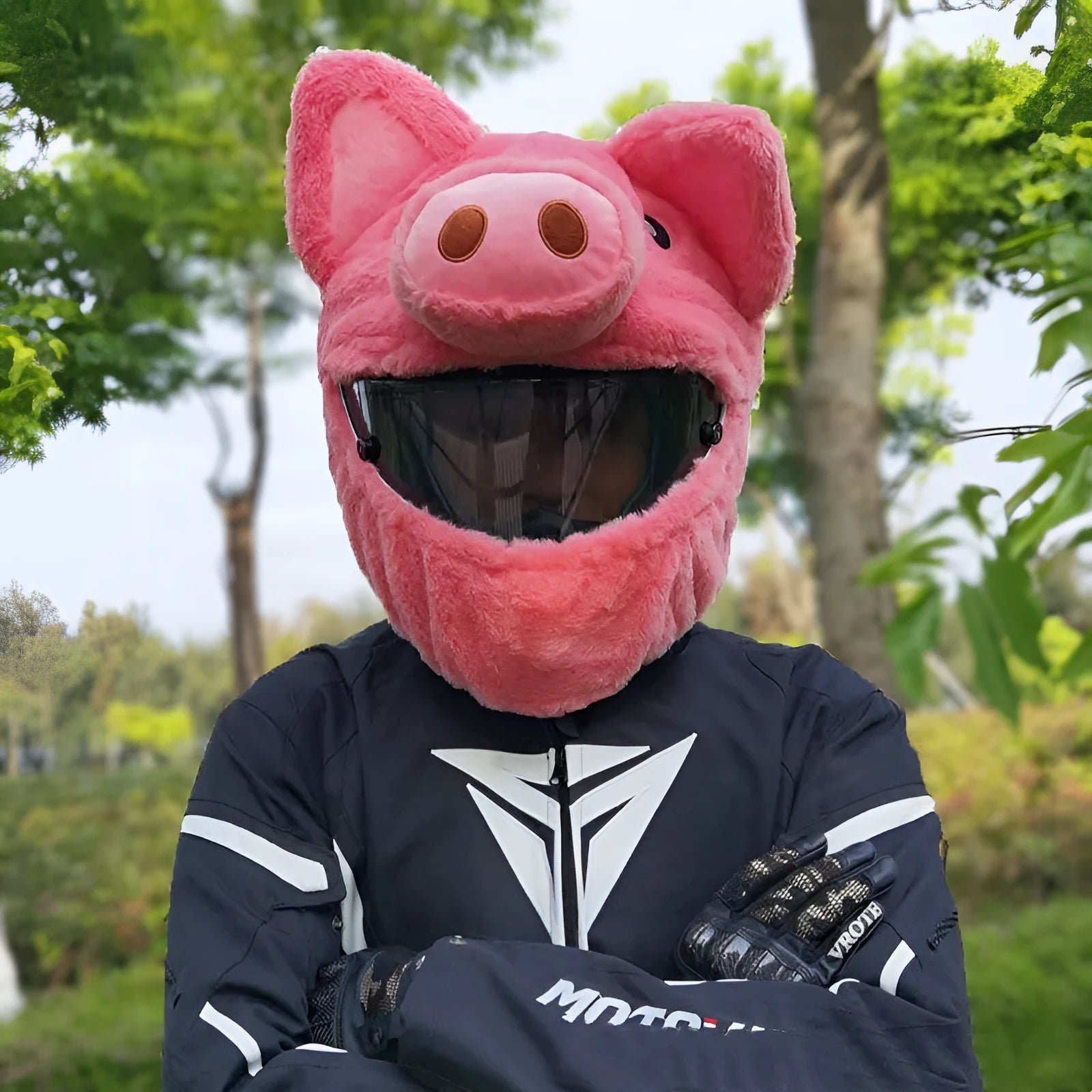 Pink pig cartoon plush helmet protective hood for motorcycle helmets with matching sleeve.