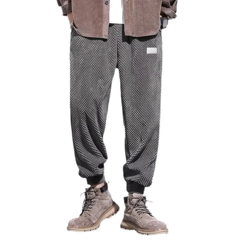 Men's grey ankle-tied straight leg casual sweatpants laid flat