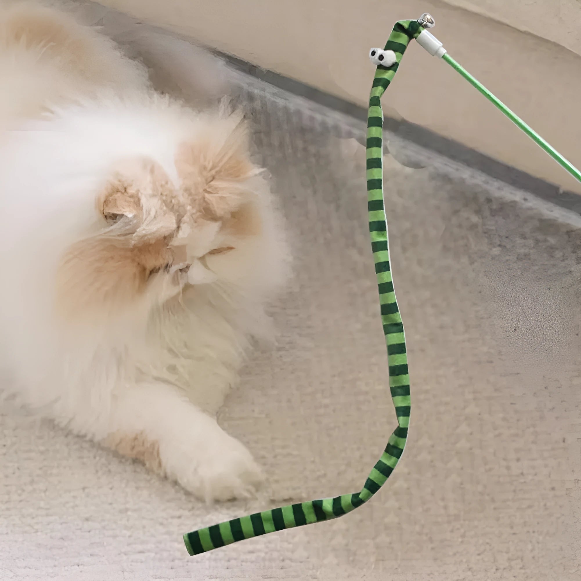 Cat wand toy with colourful plush strip attached to polycarbonate pole, shown in green colour option