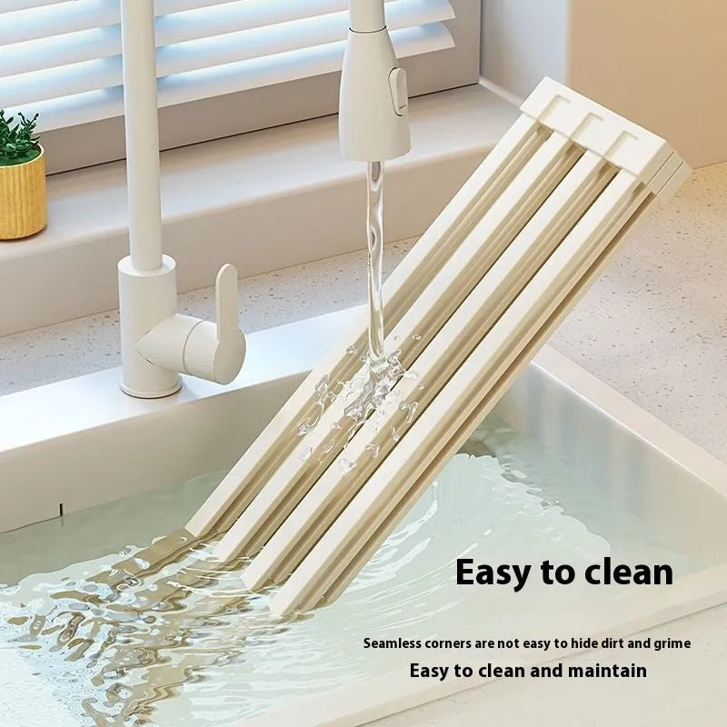 Foldable milky white stainless steel kitchen draining rack shown open and closed, with size options from 32cm to 55cm wide.