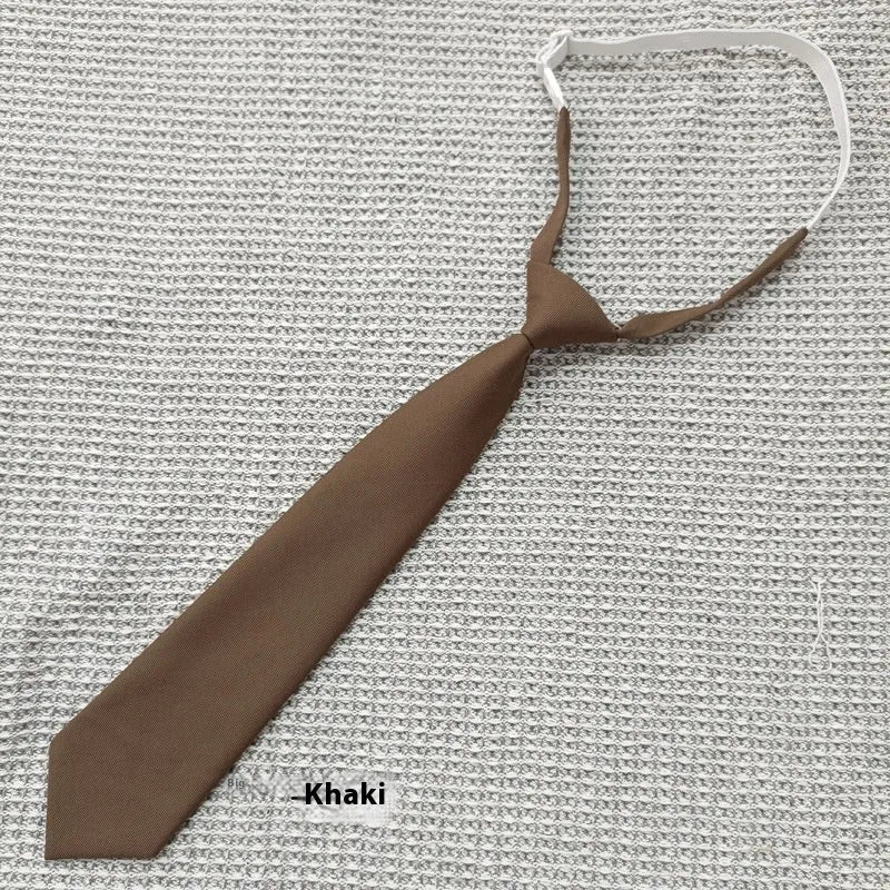 Men's navy blue cotton bow tie with arrow-style design on a white background.