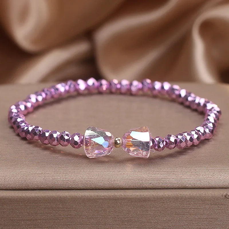 Colourful artificial crystal butterfly bracelet in blue, dark pink, and light pink, handcrafted with ethnic style for women
