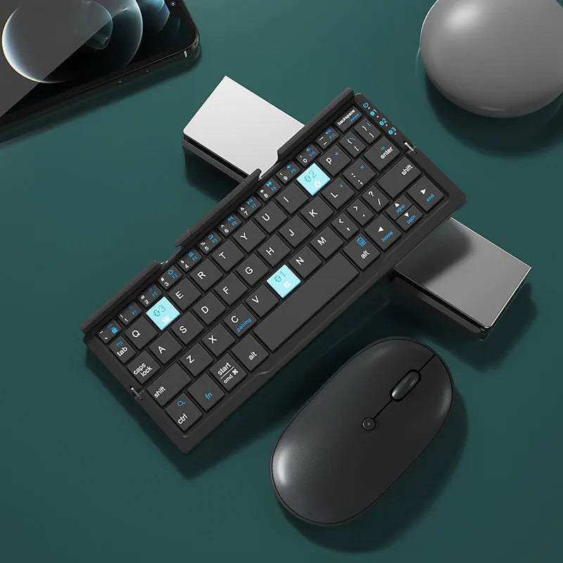 Silver white folding Bluetooth keyboard with integrated stand holding a smartphone
