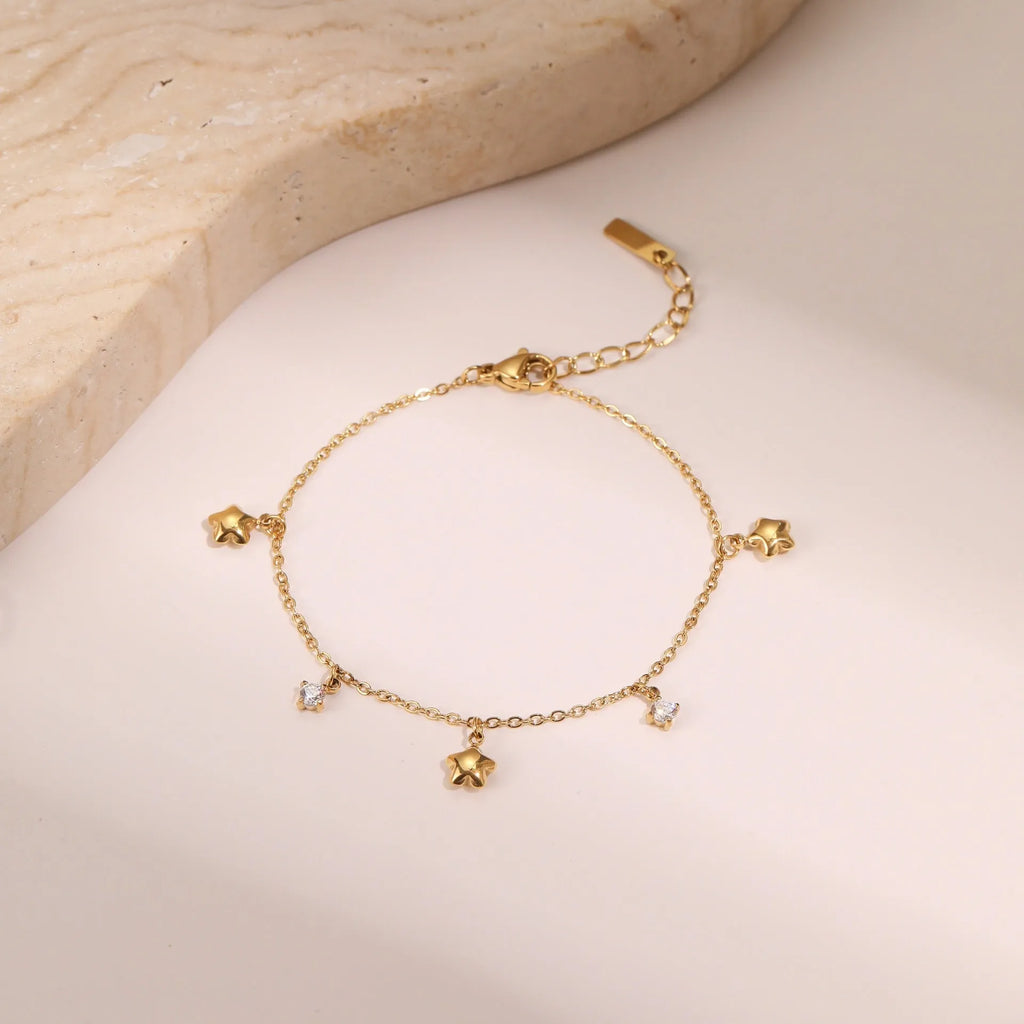 Women's stainless steel bracelet with 18K gold plating and geometric star pendant