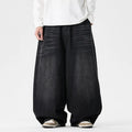 Men's plus size baggy jeans in light blue denim with wide straight legs and a low waist.