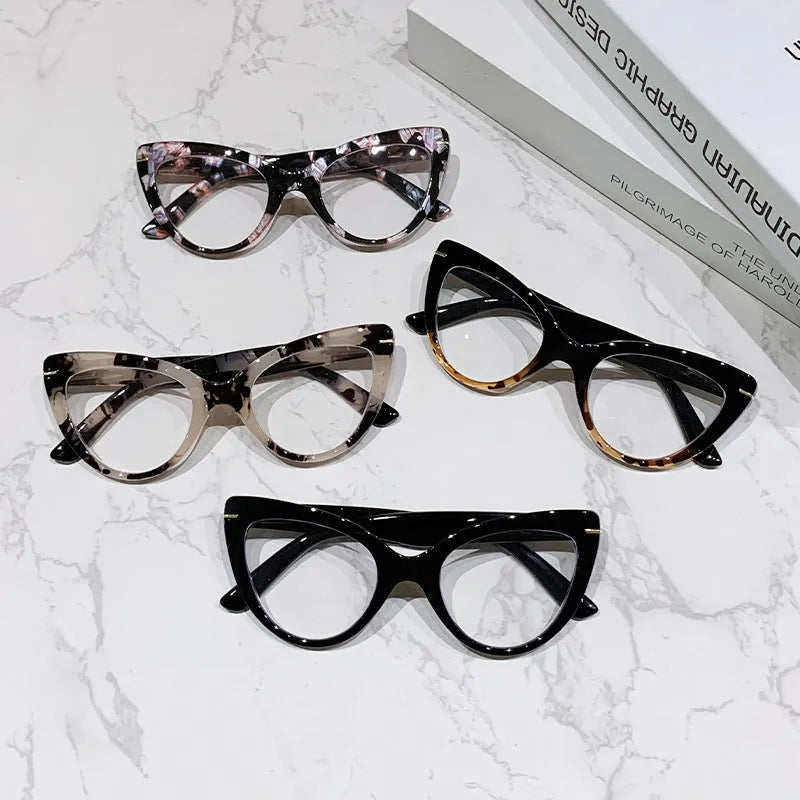 Women's cat eye reading glasses with large frames showing dragon and phoenix decorations
