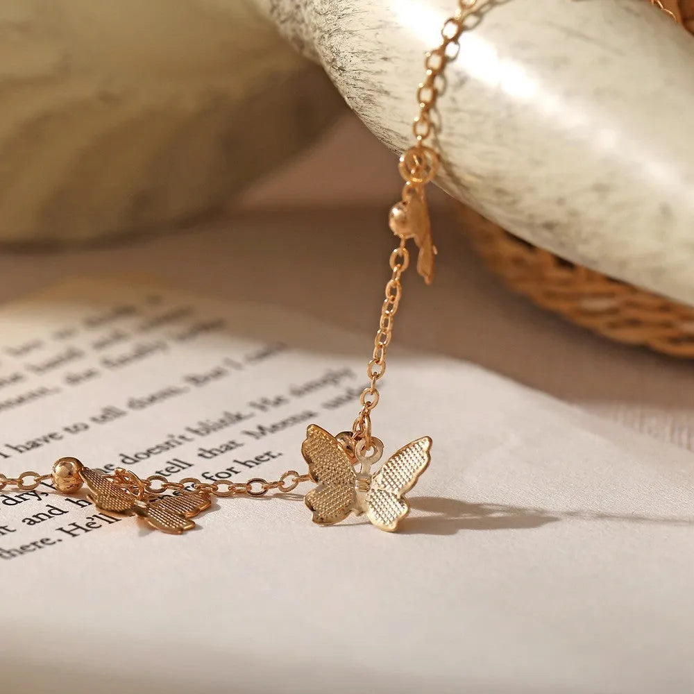 Alloy butterfly anklet for women in gold finish on ankle, hollow design beach foot ornament