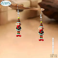 Handmade flat acrylic earrings with cartoon soldier design in Christmas style