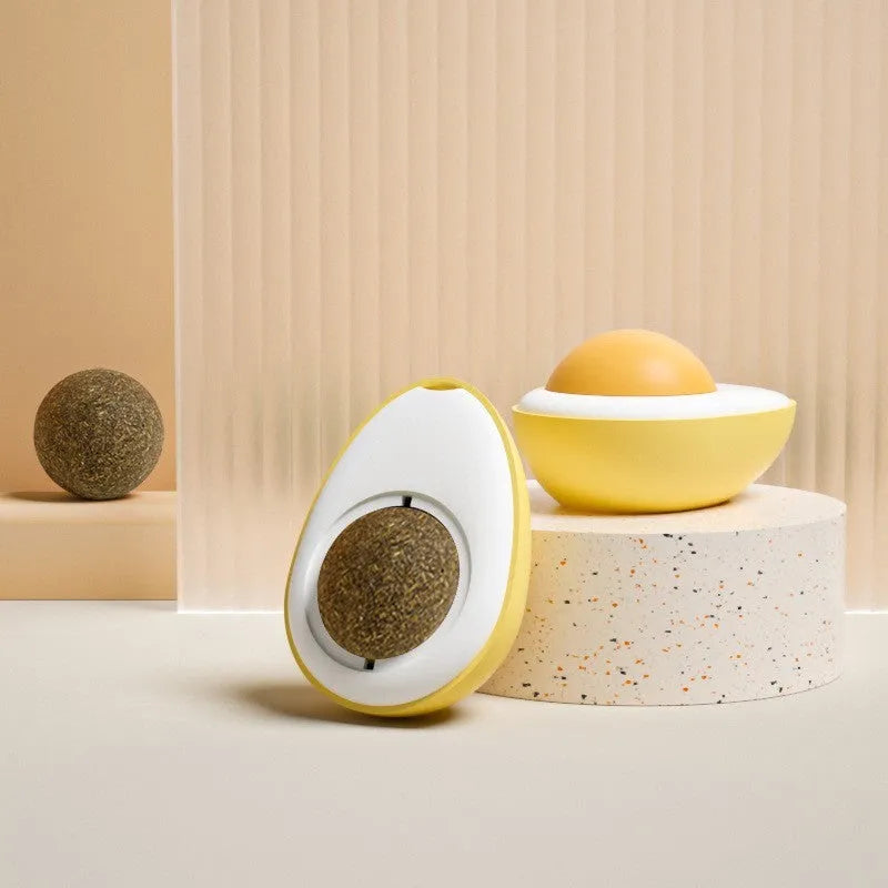 Interactive catnip ball toy stuck to wall with cat playing, showing fried egg and poached egg shape options