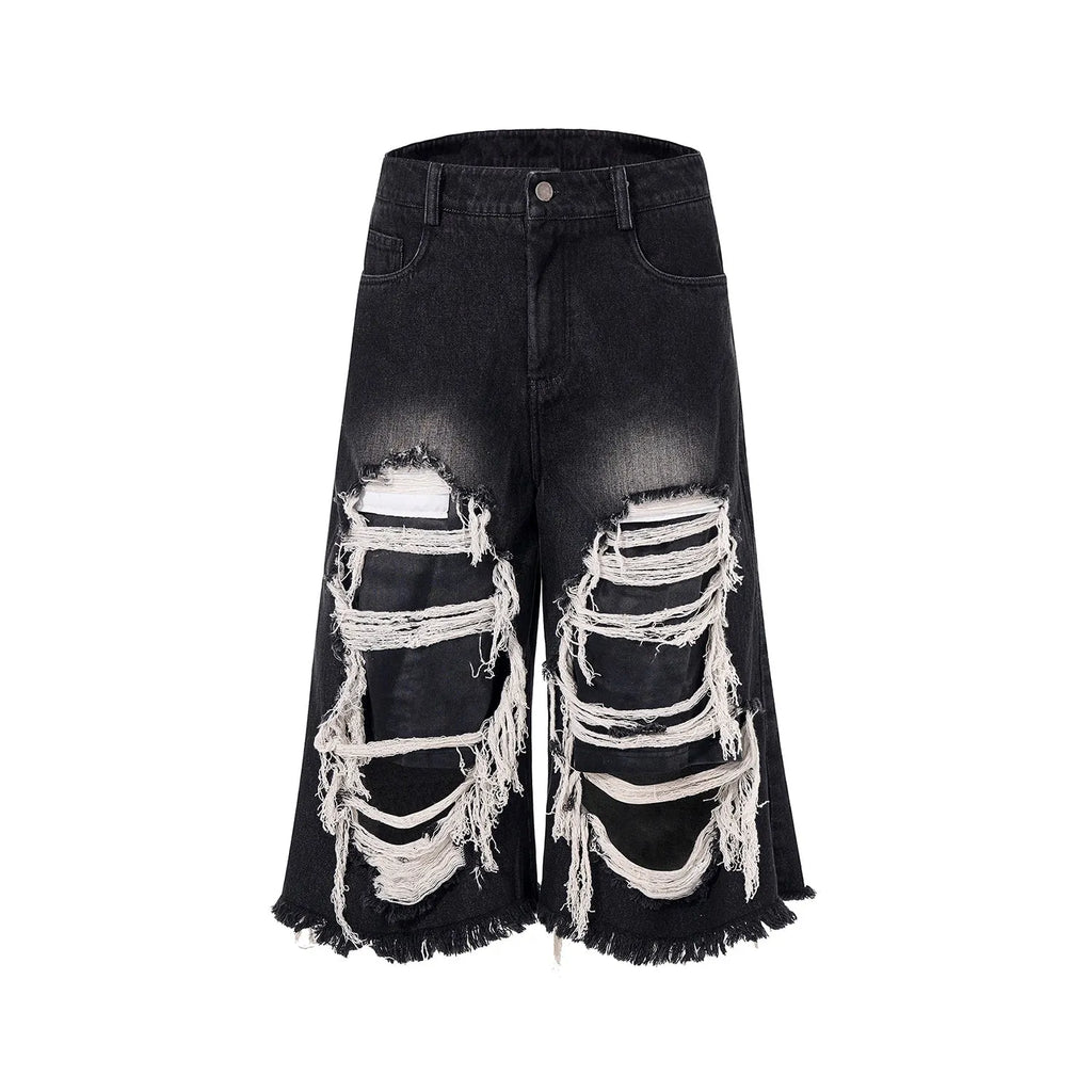 Black cropped wide-leg jeans with mid-high waist on mannequin showing loose fit and micro-elastic cotton denim