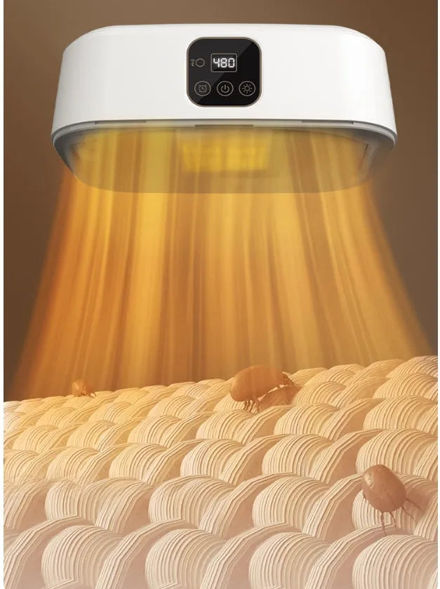 White cylindrical portable laundry drier with remote control on flat surface