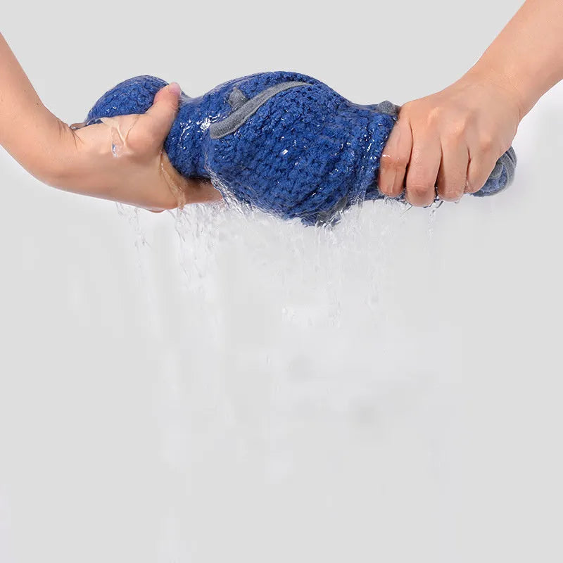 Blue quick drying dog bath robe towel with adjustable waistband placed on a fluffy mat
