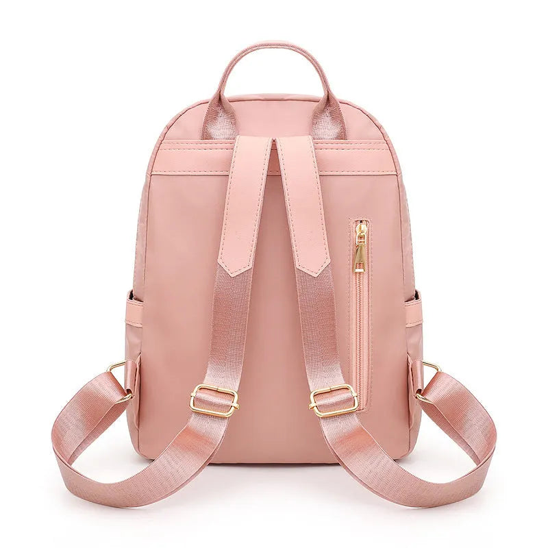 Women's black casual nylon backpack with double shoulder straps showing interior organisation compartments