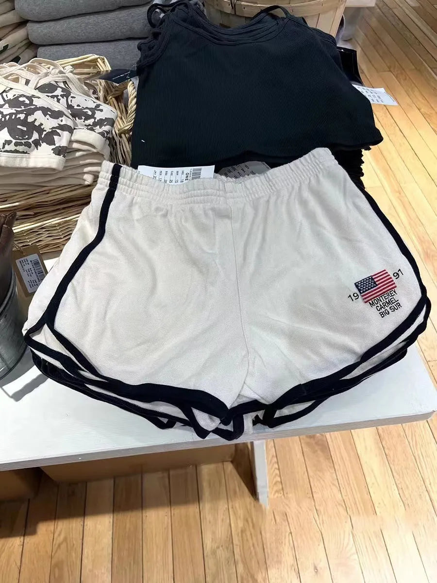 Women's navy blue cotton sports hot pants with white flag embroidery and high top styling