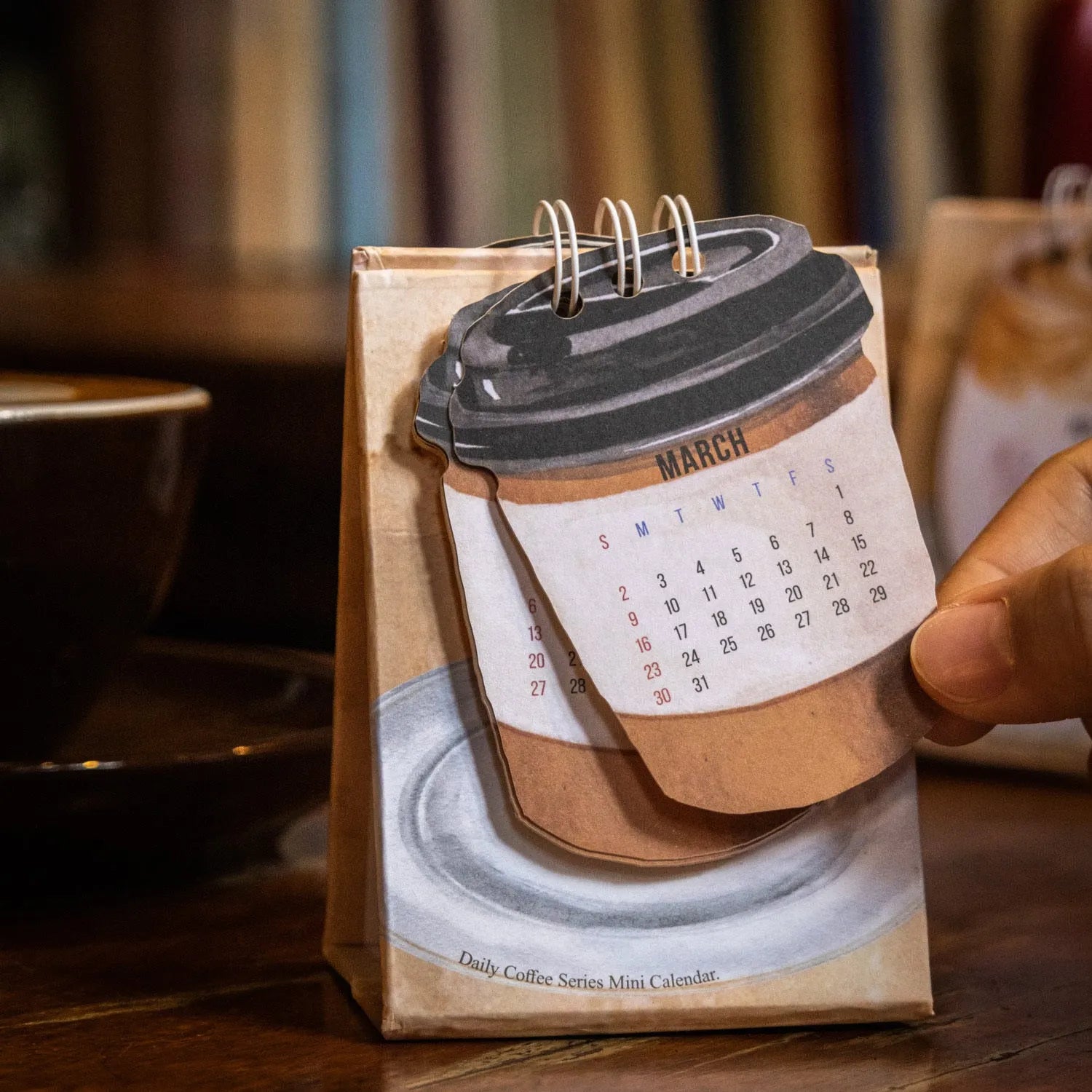 2025 mini desk calendar set showing ten different paper designs including Coffee Time and Life Is Not Easy.