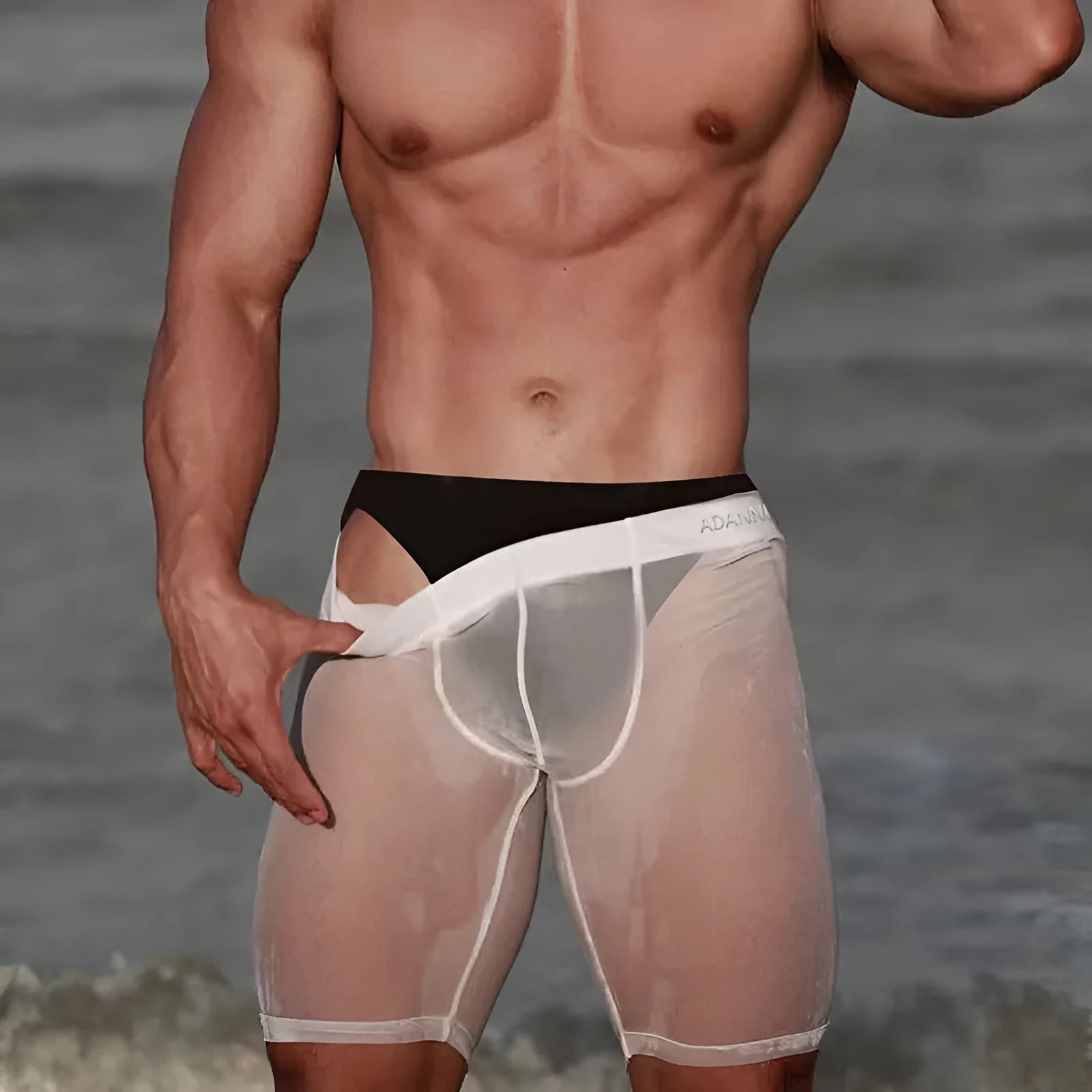Men's seamless nylon mesh shorts in black, shown laid flat