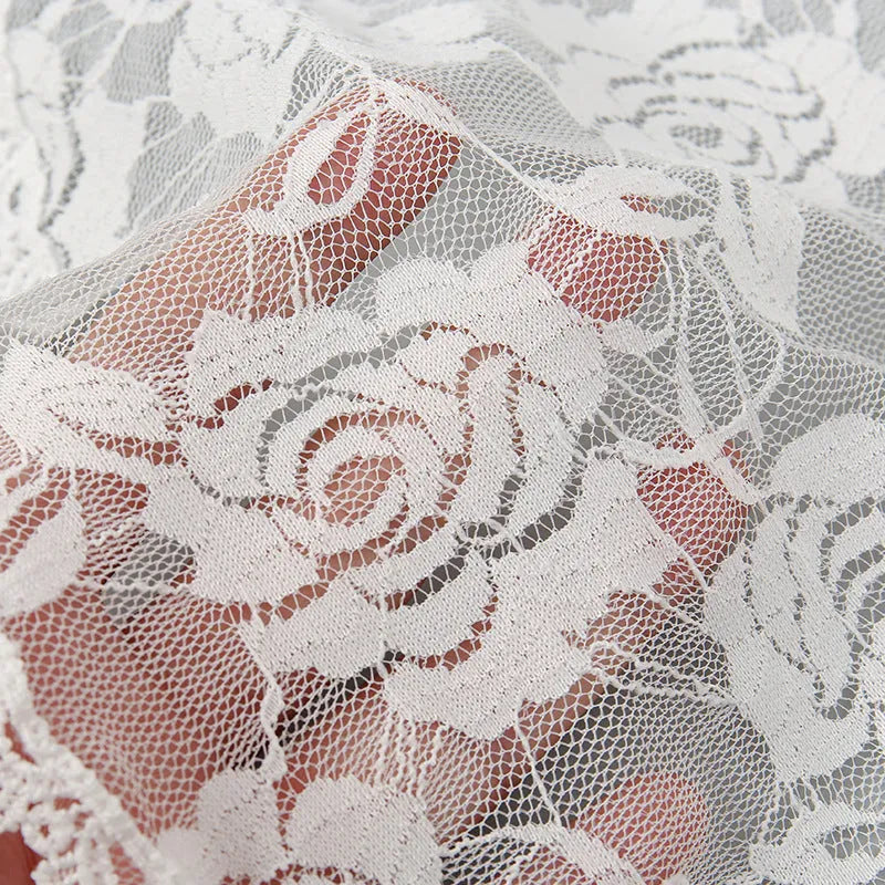 Round white bridal head cover with floral decoration measuring 30cm