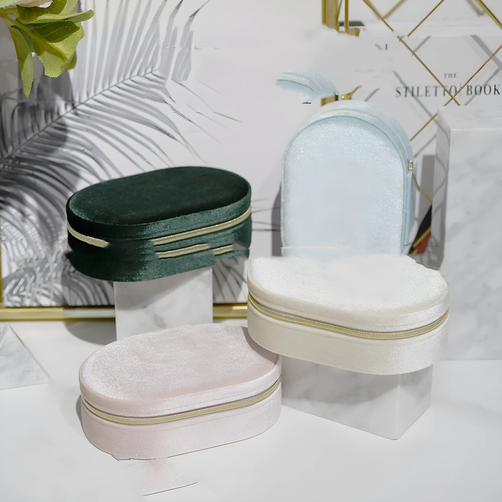Oval velvet jewellery storage box in multiple colours with flannel interior measuring 15x10x5cm