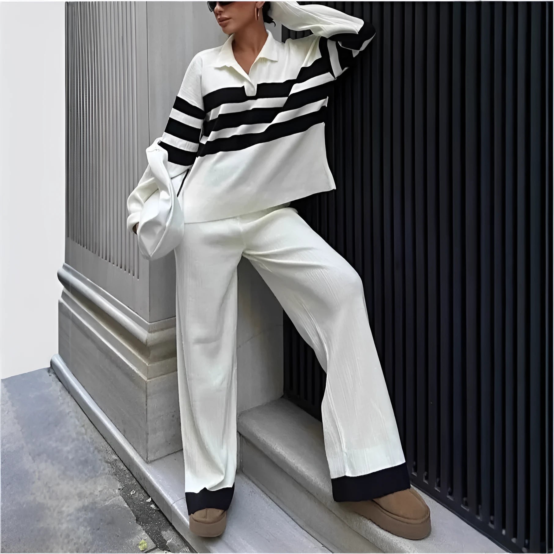 Women's black and white striped polo collar knitted shirt with matching trousers two-piece set