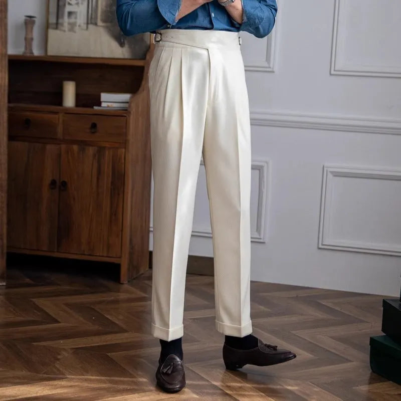 Man wearing black high waist straight leg casual trousers made from polyester fabric.
