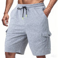 Men's heavy towel fabric cargo shorts with multiple pockets in light grey colour showing elastic waistband and loose fit design