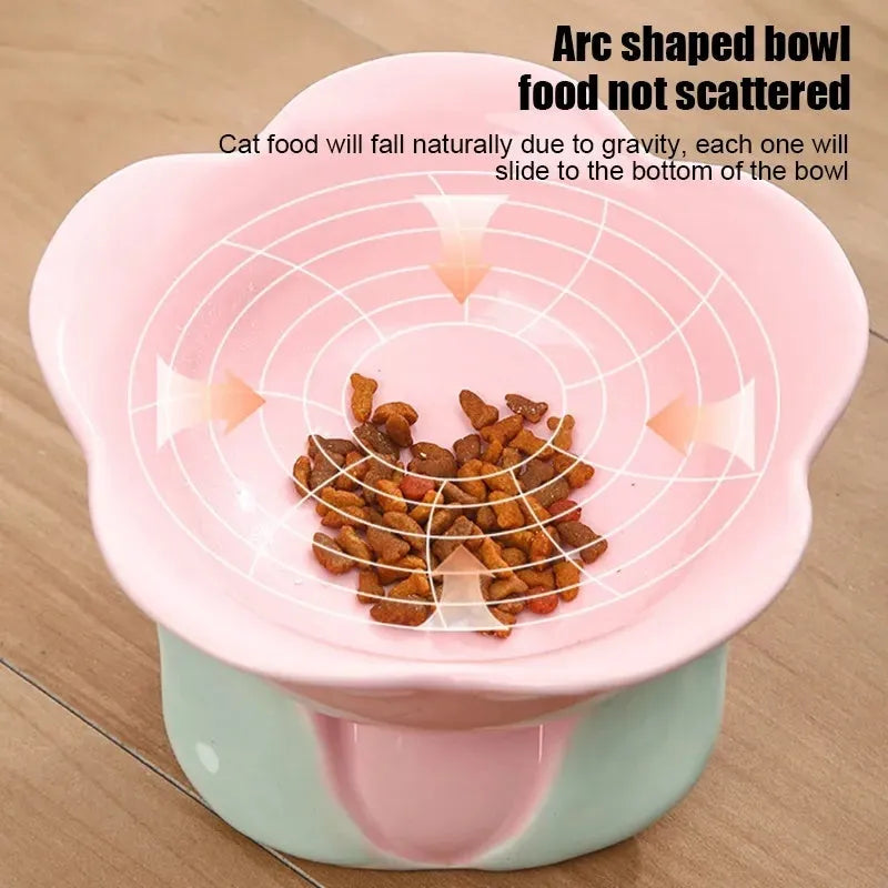 Blue ceramic raised pet bowl with floral pattern and non-slip base for cats and small dogs.