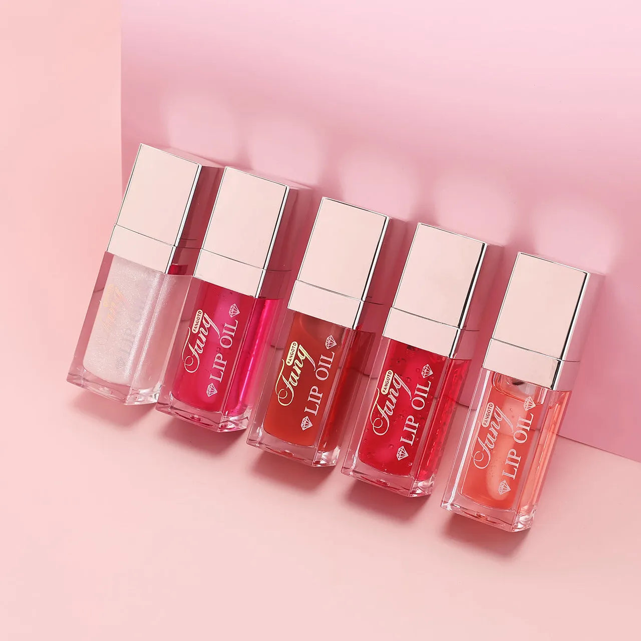 Set of five bright mint lip gloss tubes and one lip essence oil bottle for moisturising and repair.